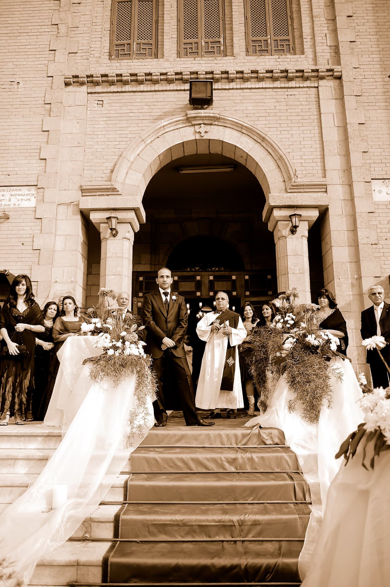 Groom waiting at the church doors as the bride arrives